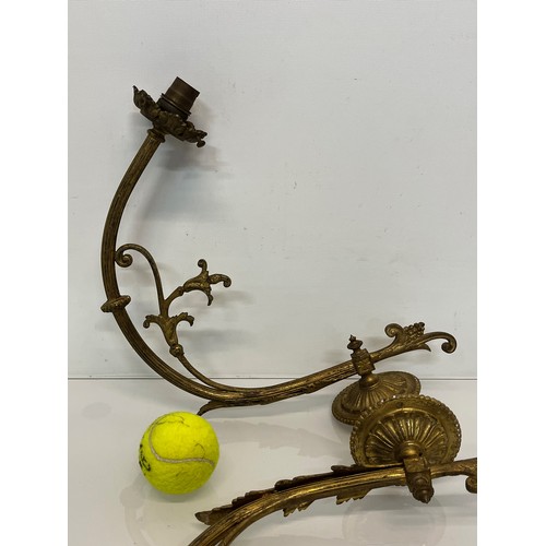 192 - Pair of gilded cast brass decorative light sconces.

This lot is available for in-house packing and ... 