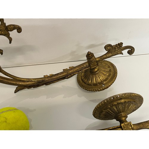 192 - Pair of gilded cast brass decorative light sconces.

This lot is available for in-house packing and ... 