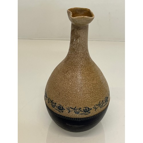 199 - Stoneware bottle with crackle glaze and hand decorated with flowers.

This lot is available for in-h... 