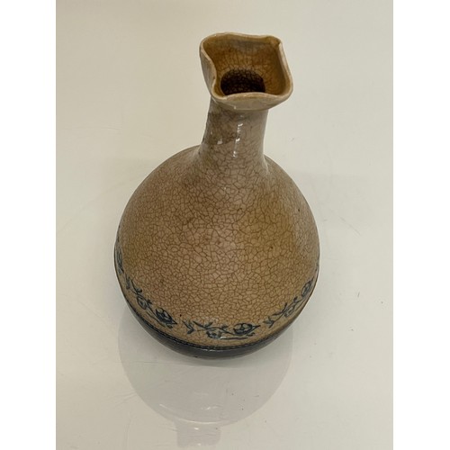 199 - Stoneware bottle with crackle glaze and hand decorated with flowers.

This lot is available for in-h... 