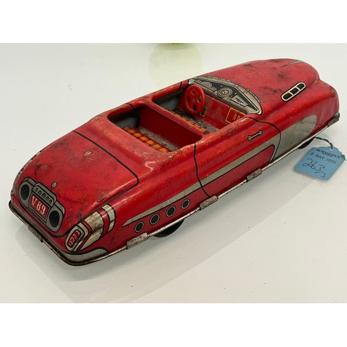 208 - Two tinplate toy cars, a friction dive two door saloon and a lithographed open topped roadster by Ma... 