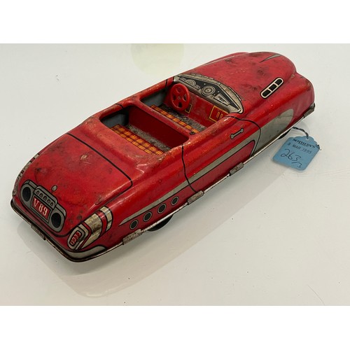 208 - Two tinplate toy cars, a friction dive two door saloon and a lithographed open topped roadster by Ma... 