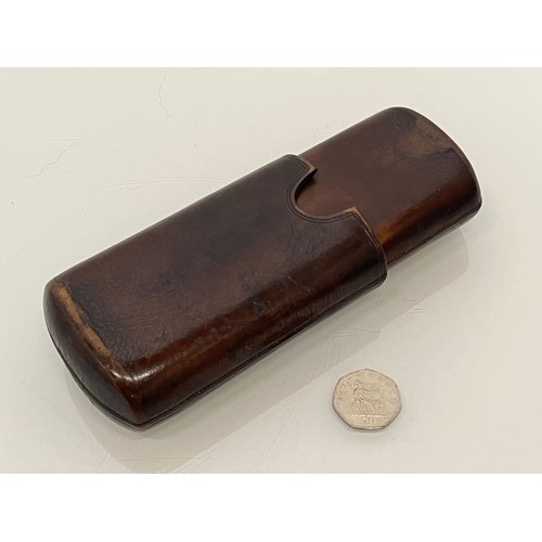 219 - Leather cigar case.

This lot is available for in-house packing and shipping