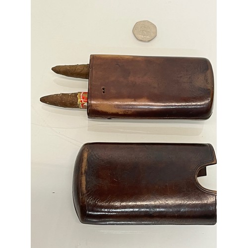 219 - Leather cigar case.

This lot is available for in-house packing and shipping