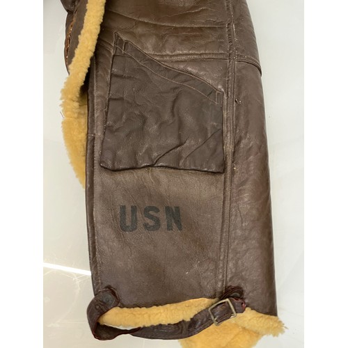 225 - Militaria, WWII American a pair of sheepskin winter flying trousers marked for USN.

Length of zip f... 