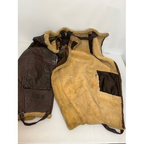 225 - Militaria, WWII American a pair of sheepskin winter flying trousers marked for USN.

Length of zip f... 