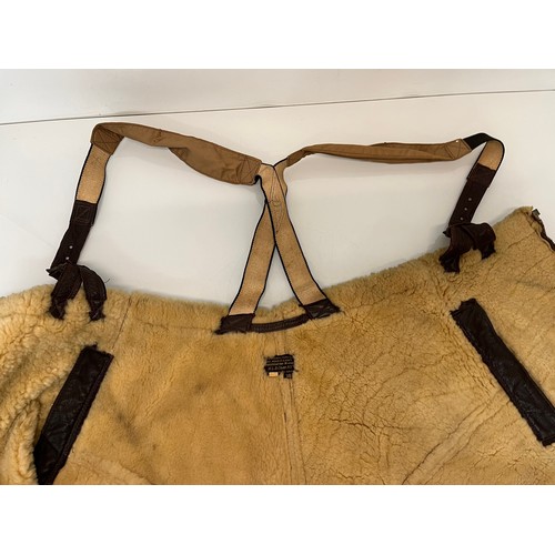 225 - Militaria, WWII American a pair of sheepskin winter flying trousers marked for USN.

Length of zip f... 