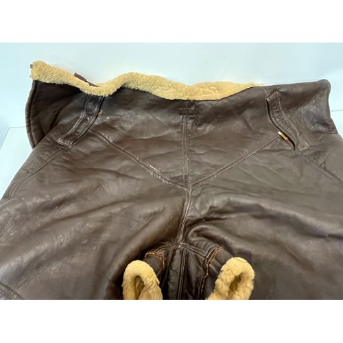 225 - Militaria, WWII American a pair of sheepskin winter flying trousers marked for USN.

Length of zip f... 