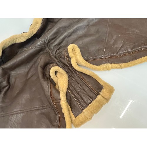 225 - Militaria, WWII American a pair of sheepskin winter flying trousers marked for USN.

Length of zip f... 