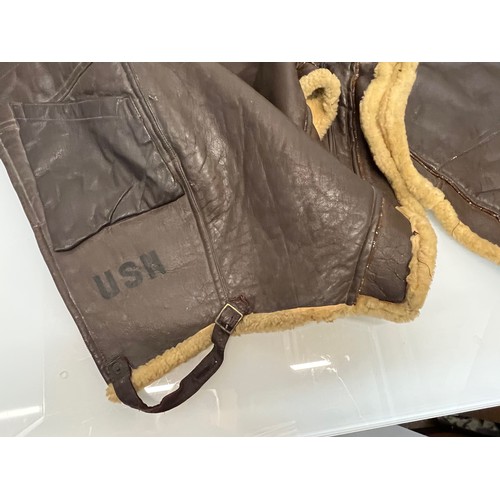 225 - Militaria, WWII American a pair of sheepskin winter flying trousers marked for USN.

Length of zip f... 