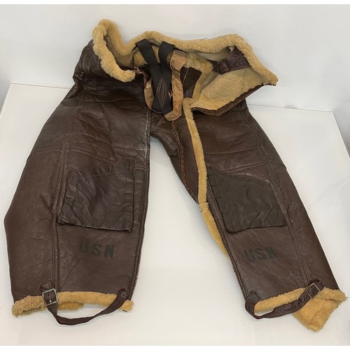 225 - Militaria, WWII American a pair of sheepskin winter flying trousers marked for USN.

Length of zip f... 