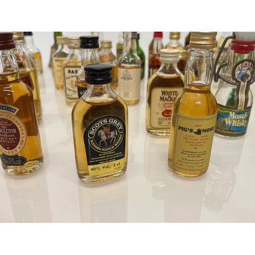 240 - Collection of miniature spirit bottles, Malt and Blended Whisky, Rum, Brandy Gin etc.

This lot is a... 