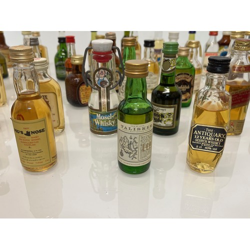 240 - Collection of miniature spirit bottles, Malt and Blended Whisky, Rum, Brandy Gin etc.

This lot is a... 