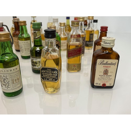 240 - Collection of miniature spirit bottles, Malt and Blended Whisky, Rum, Brandy Gin etc.

This lot is a... 