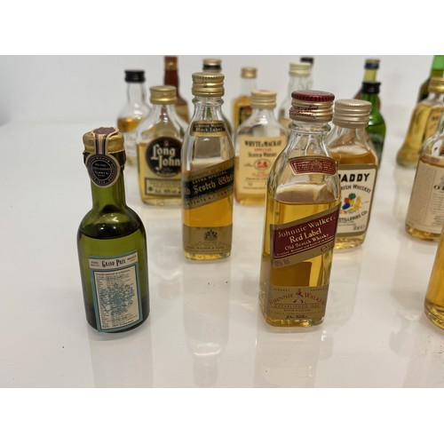 240 - Collection of miniature spirit bottles, Malt and Blended Whisky, Rum, Brandy Gin etc.

This lot is a... 