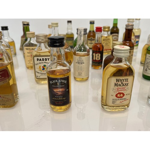 240 - Collection of miniature spirit bottles, Malt and Blended Whisky, Rum, Brandy Gin etc.

This lot is a... 