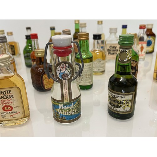 240 - Collection of miniature spirit bottles, Malt and Blended Whisky, Rum, Brandy Gin etc.

This lot is a... 