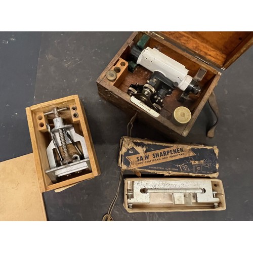 263 - Tools, a cased surveyors theodolite, a dowel drilling jig and a saw sharpener.

This lot is availabl... 