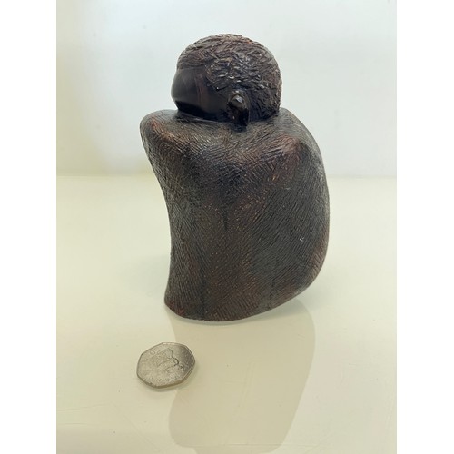 479 - Hand carved figure of an African tribesman huddled under a blanket, 15 cm high.


This lot is availa... 