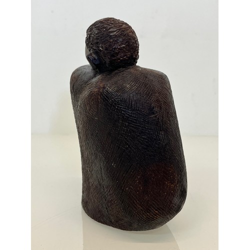 479 - Hand carved figure of an African tribesman huddled under a blanket, 15 cm high.


This lot is availa... 