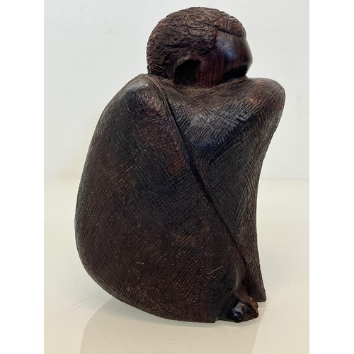 479 - Hand carved figure of an African tribesman huddled under a blanket, 15 cm high.


This lot is availa... 