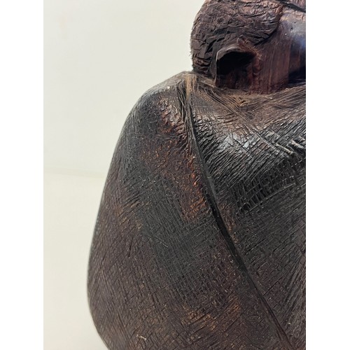 479 - Hand carved figure of an African tribesman huddled under a blanket, 15 cm high.


This lot is availa... 