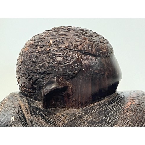 479 - Hand carved figure of an African tribesman huddled under a blanket, 15 cm high.


This lot is availa... 