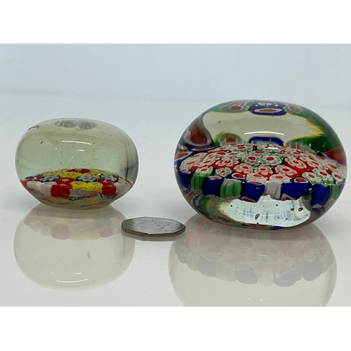 481 - Two glass paper weights.

This lot is available for in-house packing & shipping