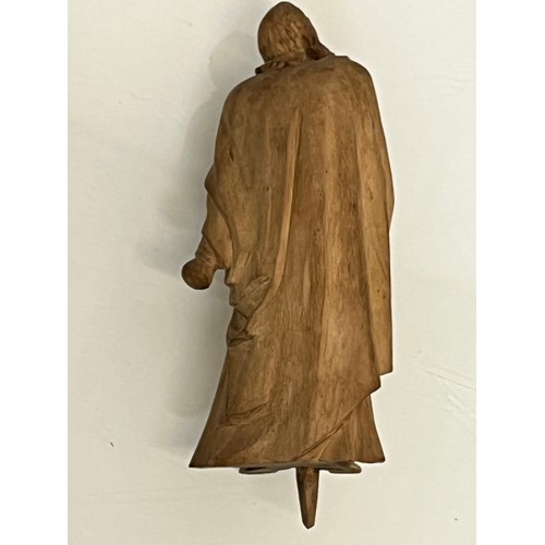 488 - A nicely detailed carved hardwood figure.


This lot is available for in-house packing & shipping