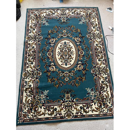 492 - Floor rug with a blue ground.

This lot is available for in-house packing & shipping