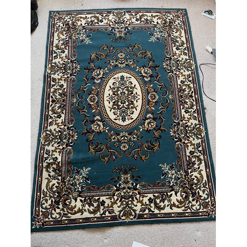 492 - Floor rug with a blue ground.

This lot is available for in-house packing & shipping