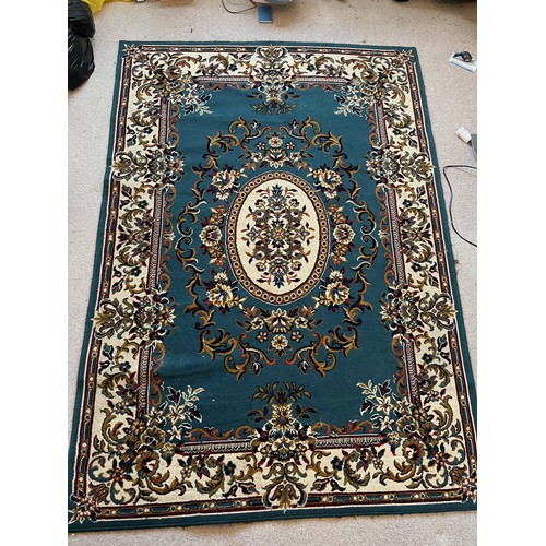 492 - Floor rug with a blue ground.

This lot is available for in-house packing & shipping