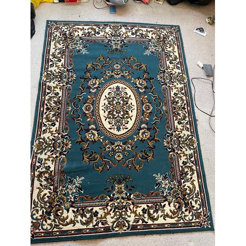 492 - Floor rug with a blue ground.

This lot is available for in-house packing & shipping