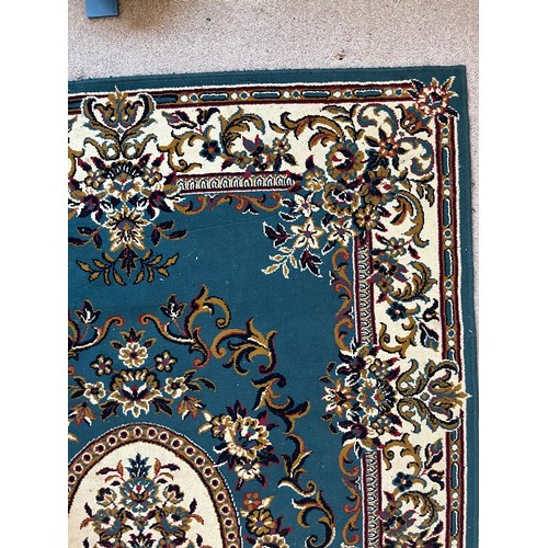 492 - Floor rug with a blue ground.

This lot is available for in-house packing & shipping