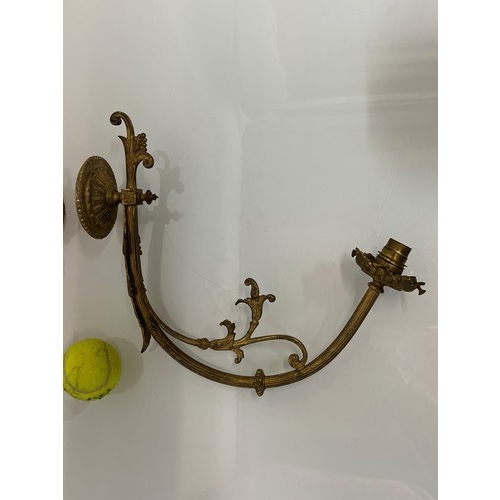 192 - Pair of gilded cast brass decorative light sconces.

This lot is available for in-house packing and ... 