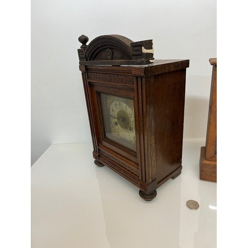 237 - Two early C20th wooden cased mantle clocks.

This lot is available for in-house shipping