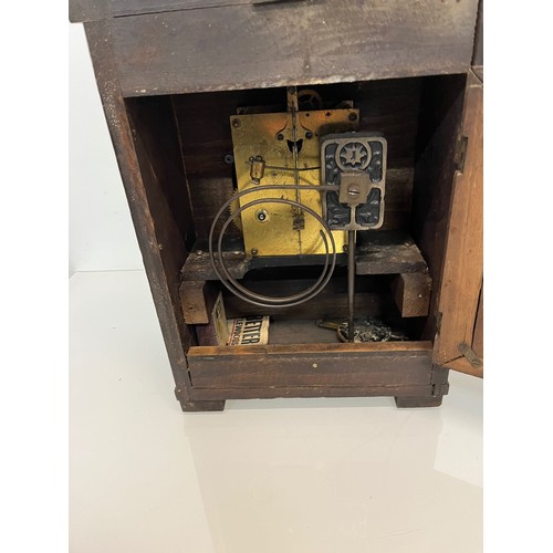 237 - Two early C20th wooden cased mantle clocks.

This lot is available for in-house shipping