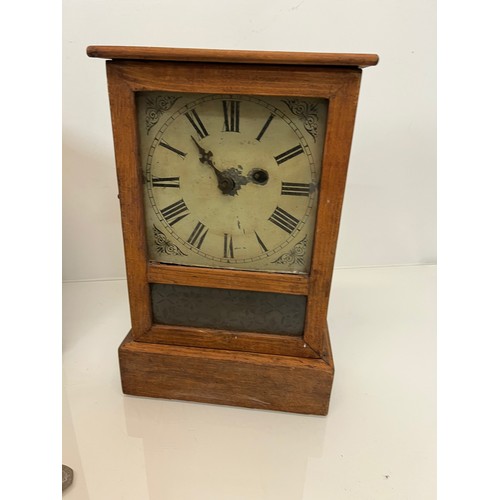237 - Two early C20th wooden cased mantle clocks.

This lot is available for in-house shipping