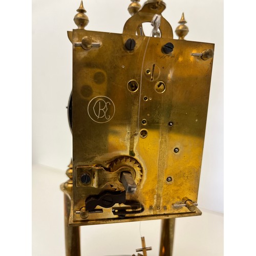 233 - Brass mantle clock in a domed glass cover.

This lot is available for in-house shipping
