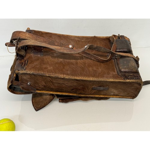 104 - Militaria, a pony skin ruck sac dated 45.

This lot is available for in-house shipping