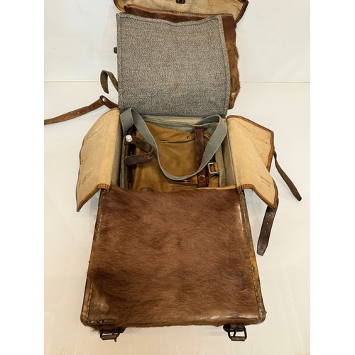 104 - Militaria, a pony skin ruck sac dated 45.

This lot is available for in-house shipping