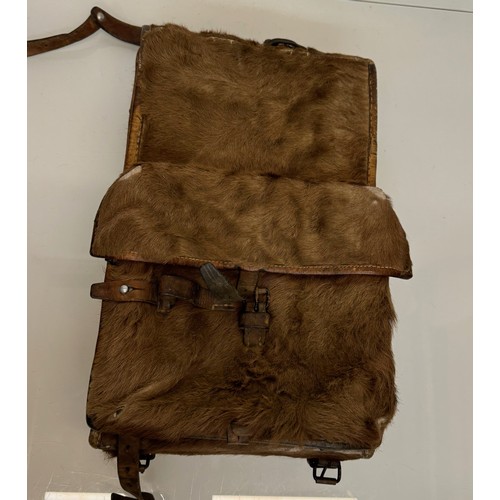 104 - Militaria, a pony skin ruck sac dated 45.

This lot is available for in-house shipping