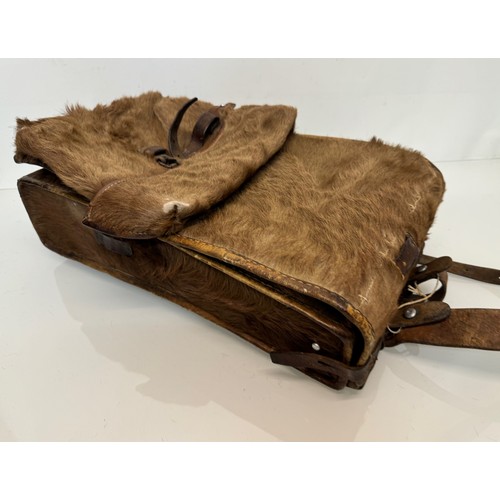 104 - Militaria, a pony skin ruck sac dated 45.

This lot is available for in-house shipping