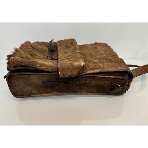 104 - Militaria, a pony skin ruck sac dated 45.

This lot is available for in-house shipping