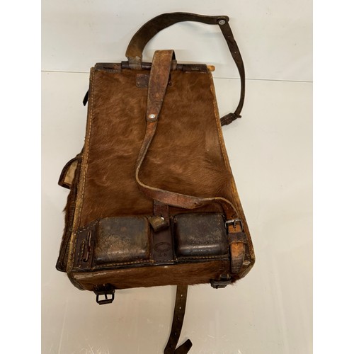 104 - Militaria, a pony skin ruck sac dated 45.

This lot is available for in-house shipping