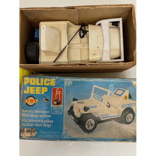 145 - Toys, two plastic Jeeps, a fire chief and a police themed model, both boxed and each is 23 cm long.
... 