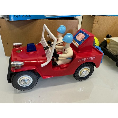 145 - Toys, two plastic Jeeps, a fire chief and a police themed model, both boxed and each is 23 cm long.
... 