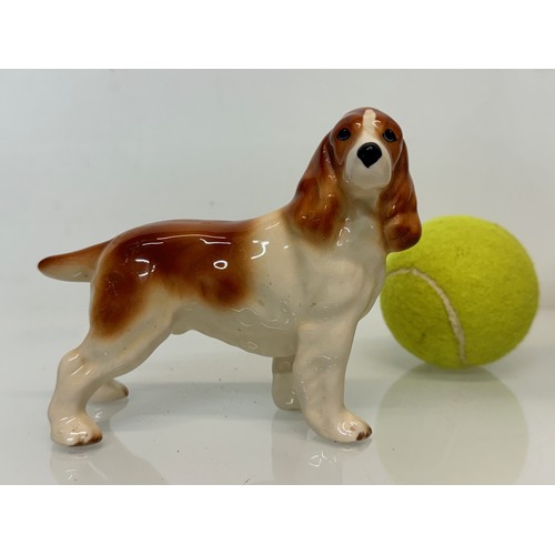 154 - Two ceramic dog figurines, a collie and a spaniel, Beswick?

This lot is available for in-house ship... 