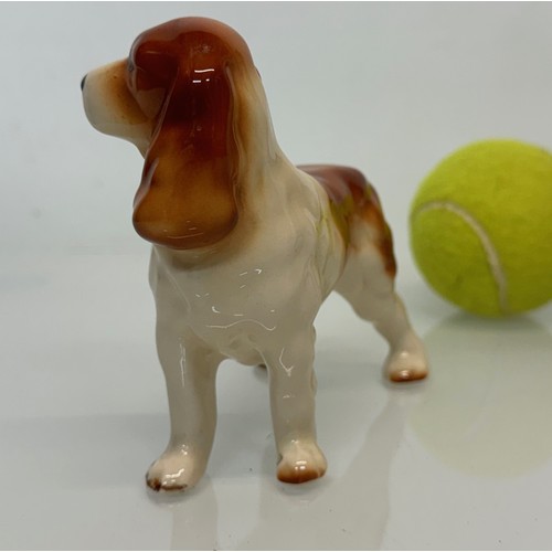 154 - Two ceramic dog figurines, a collie and a spaniel, Beswick?

This lot is available for in-house ship... 