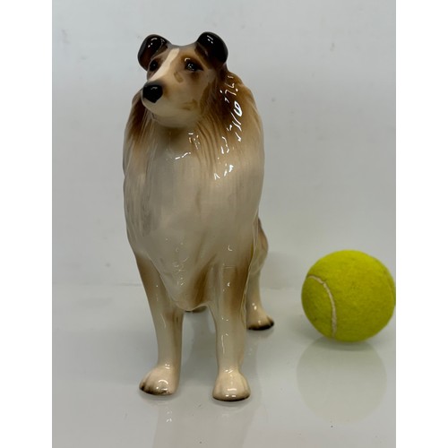 154 - Two ceramic dog figurines, a collie and a spaniel, Beswick?

This lot is available for in-house ship... 